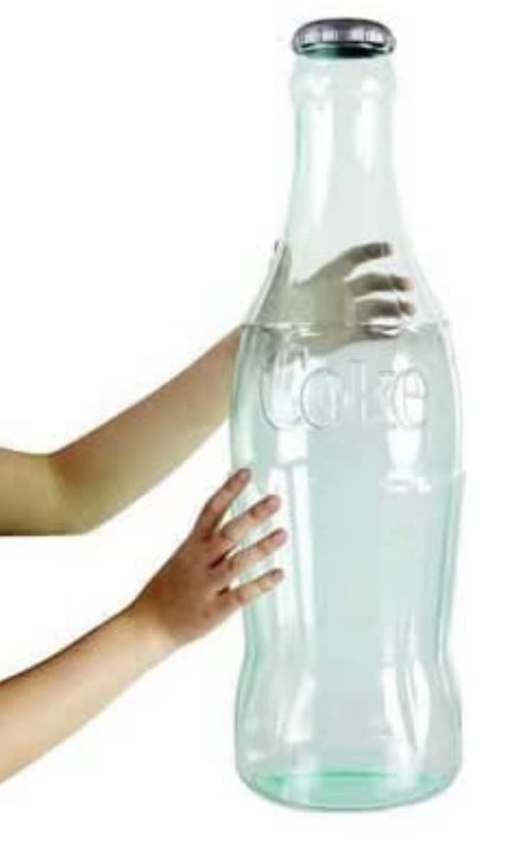 Coca-Cola 22-inch clear bottle bank; dual-pack display for homes.