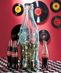 Coca-Cola red bottle bank; classic silhouette for kids' rooms.