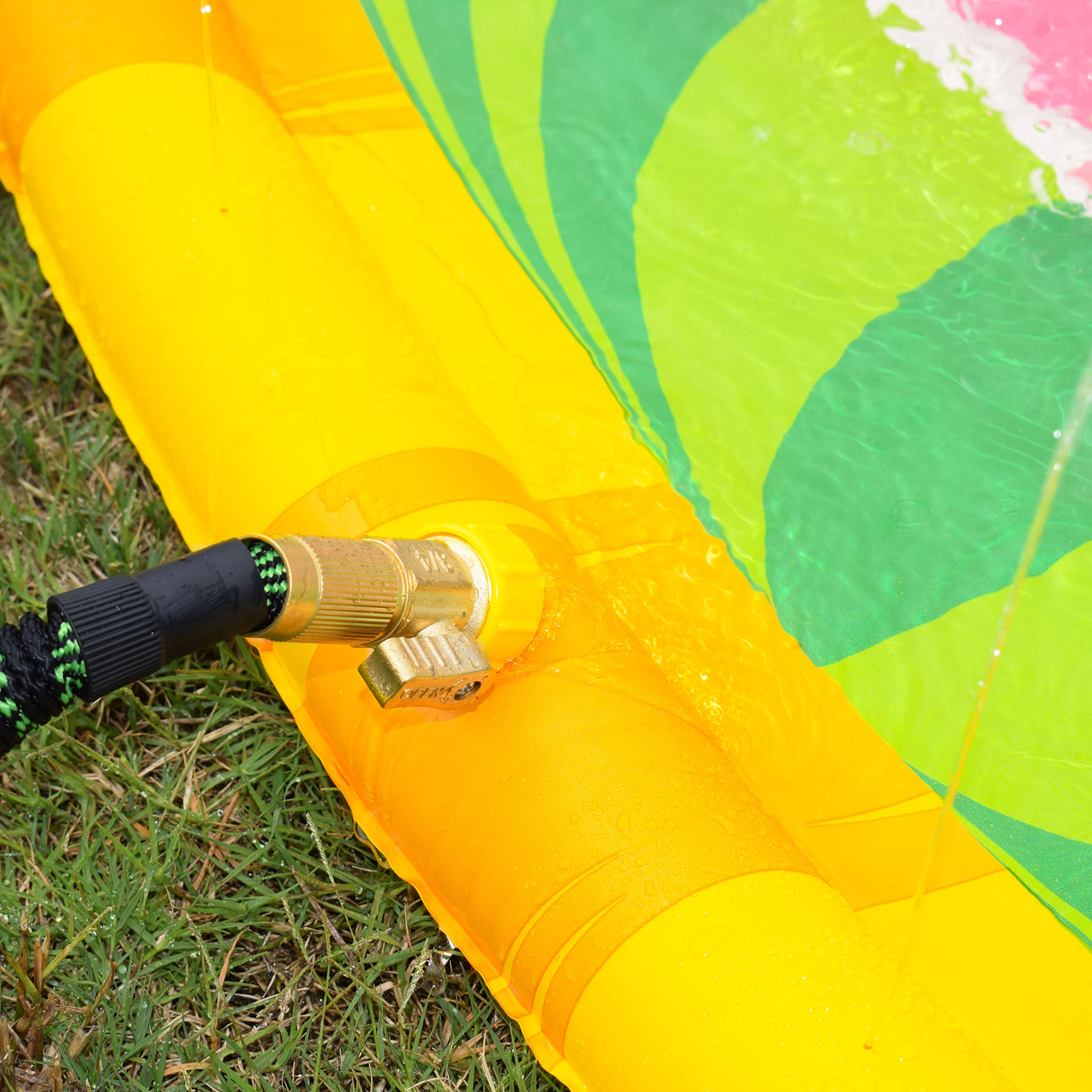 Backyard scene with CoComelon Splash Pad, ideal for family playtime and shared memories.