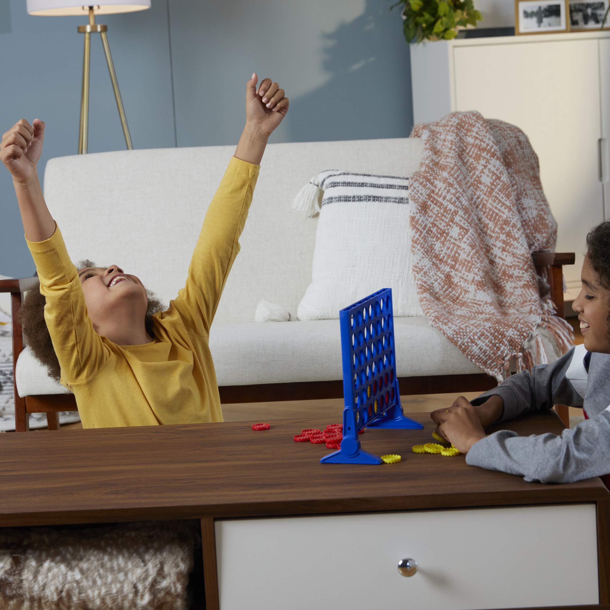 Two-player setup for classic Connect 4 on a compact table surface