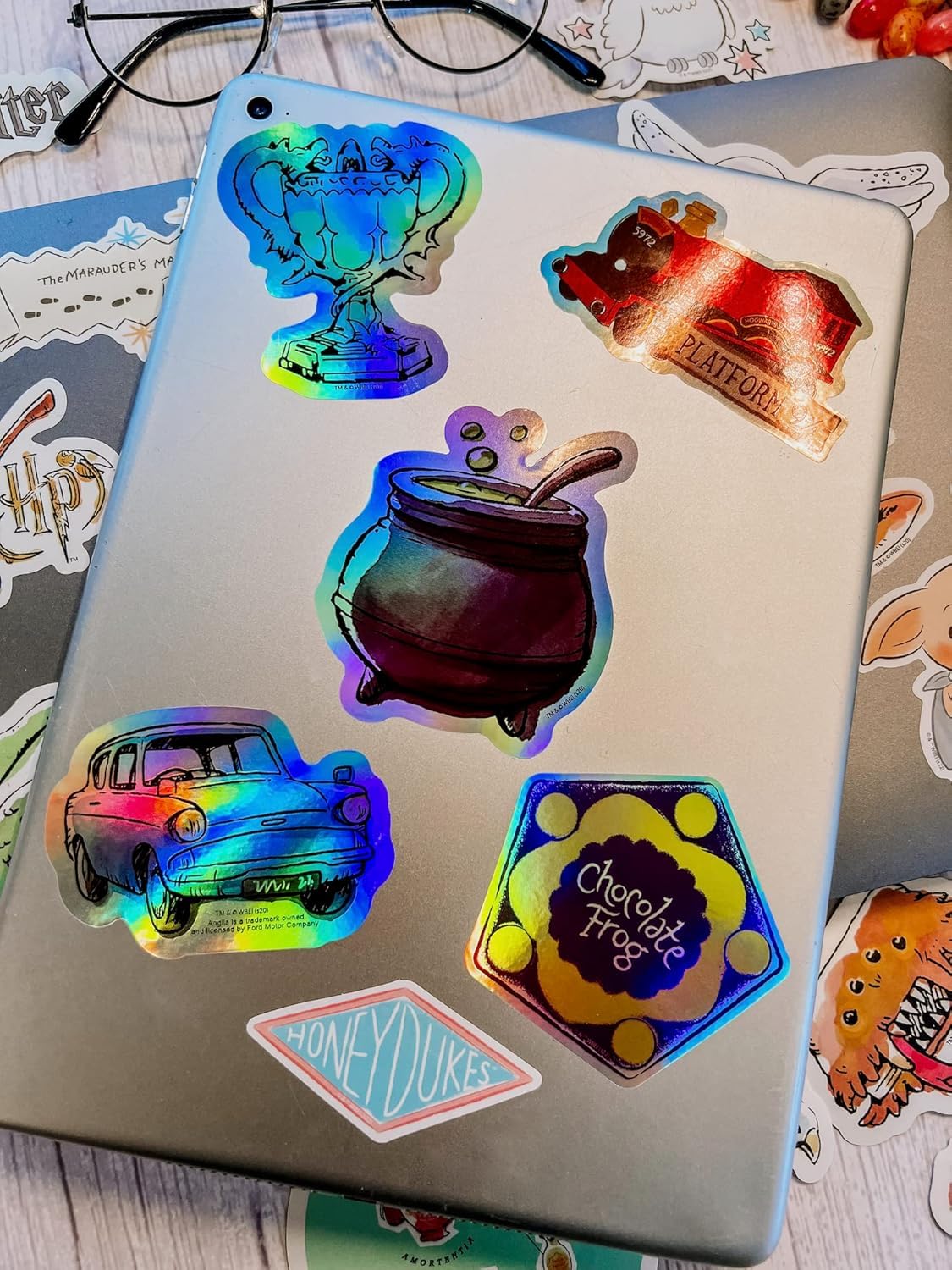 CON*QUEST Waterproof vinyl stickers resist wear on smooth surfaces.