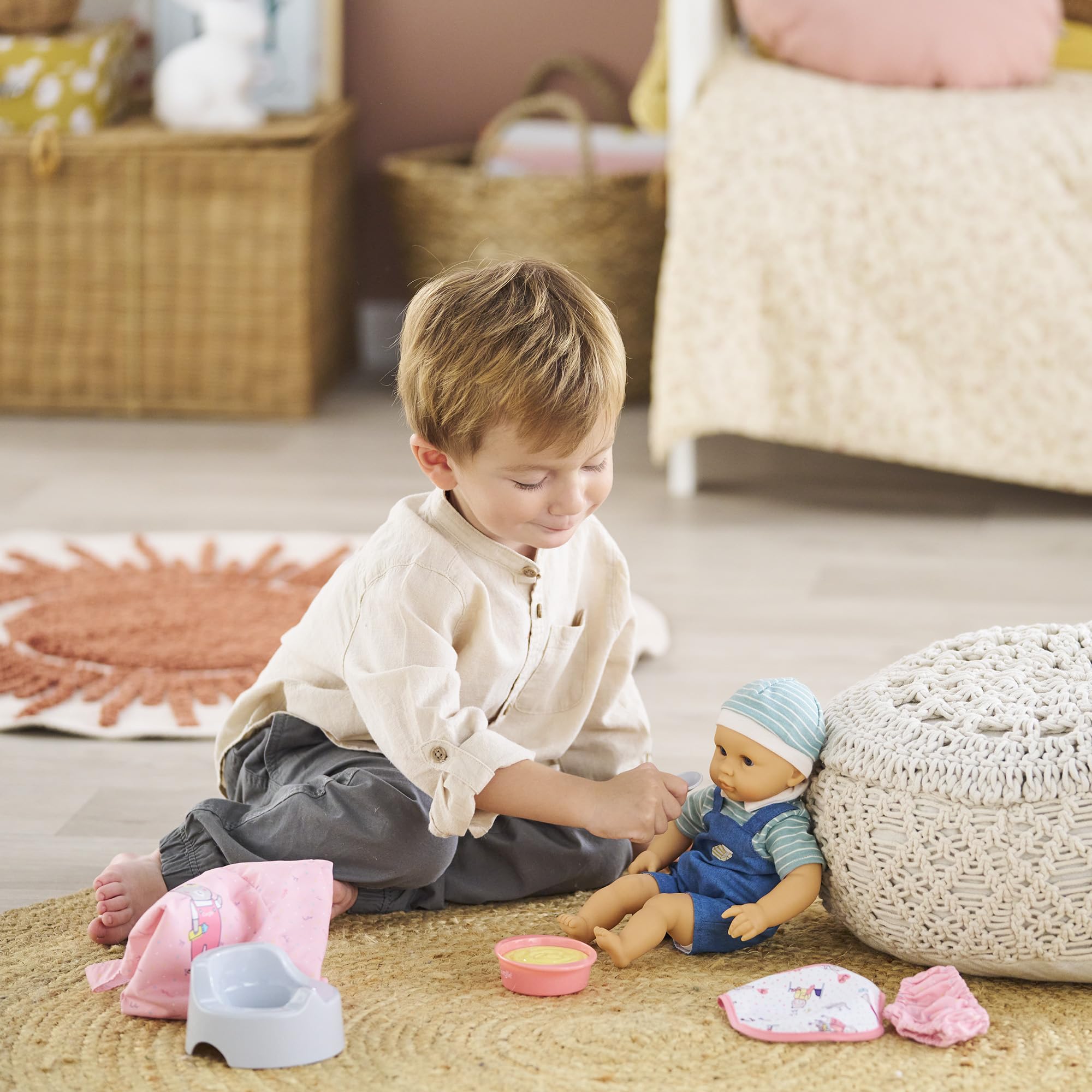 Corolle baby doll care bib on doll, gentle protection during pretend meals.