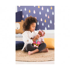 Close-up of Corolle pacifier sound button for interactive play