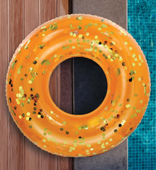 CoTa POZA orange gold float being used for lounging and light splash fun