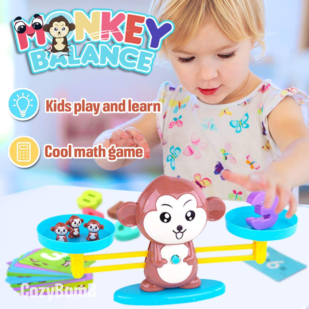 CozyBomB Monkey Scale pans enable hands-on weighing and comparison.