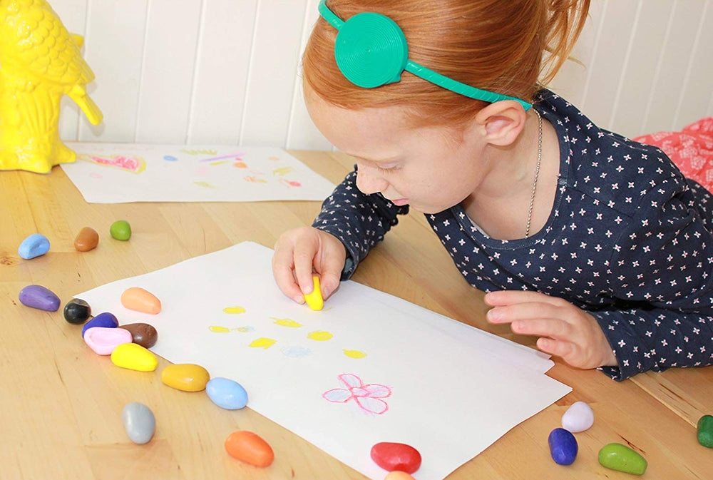 Crayon Rocks packaging includes safety guidance for caregivers.
