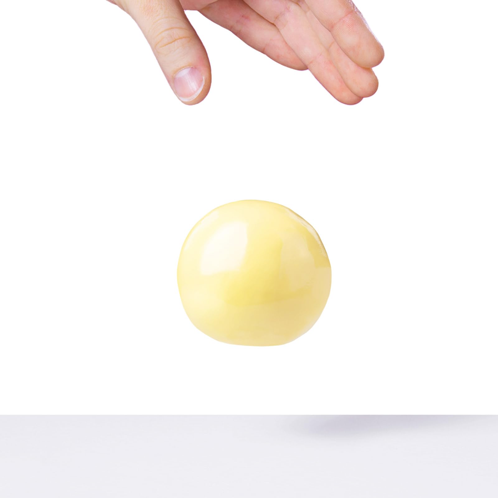 Crazy Aaron's Better Butter Thinking Putty yellow color brightens any workspace.