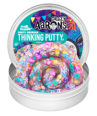 Crazy Aaron's Thinking Putty Party Animals hidden pieces inside a clear tin for discovery.