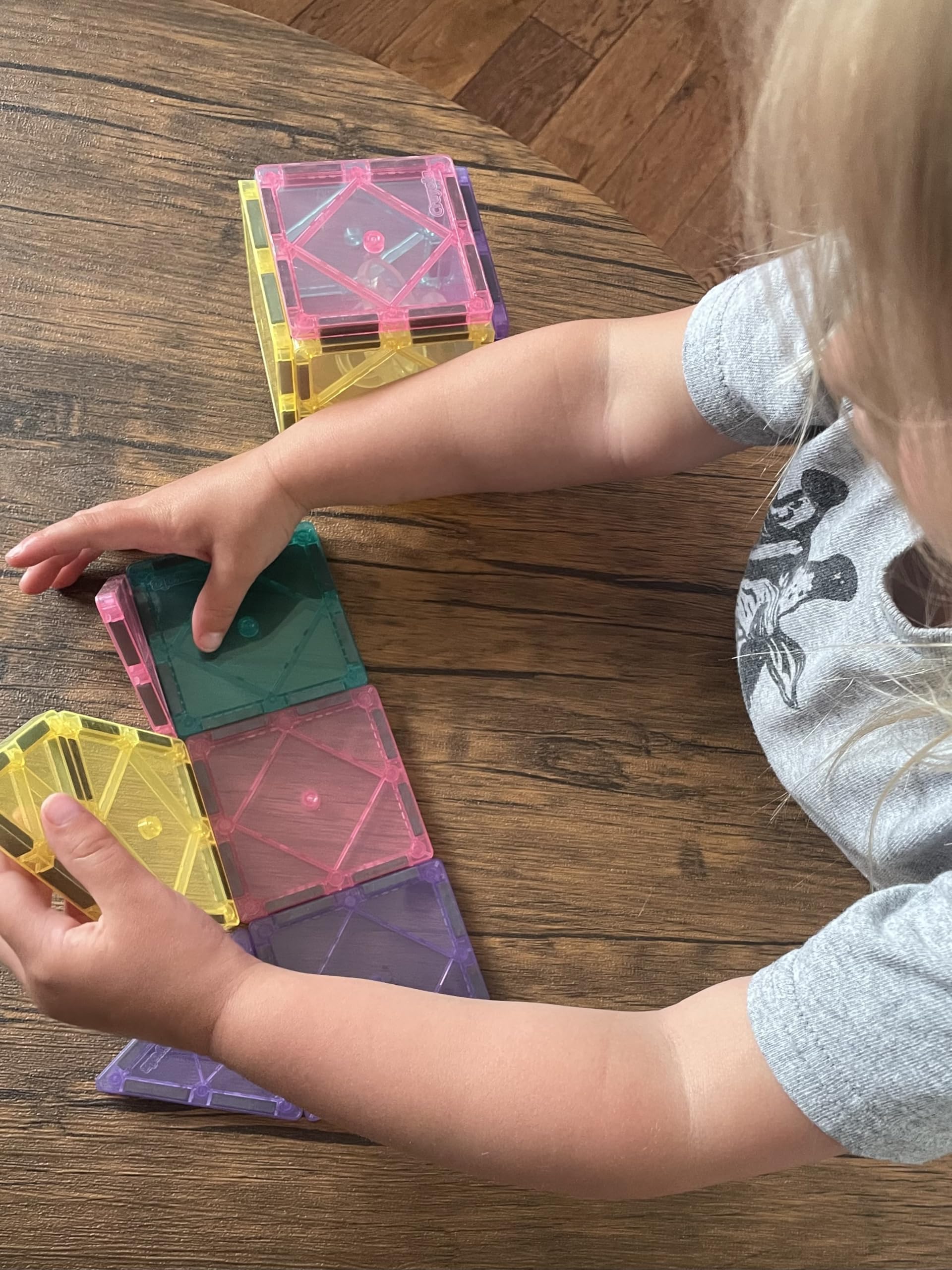 CreateOn Crayola magnetic tiles castle and rocket tiles promote imaginative storytelling.
