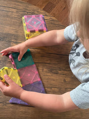 CreateOn Crayola magnetic tiles castle and rocket tiles promote imaginative storytelling.