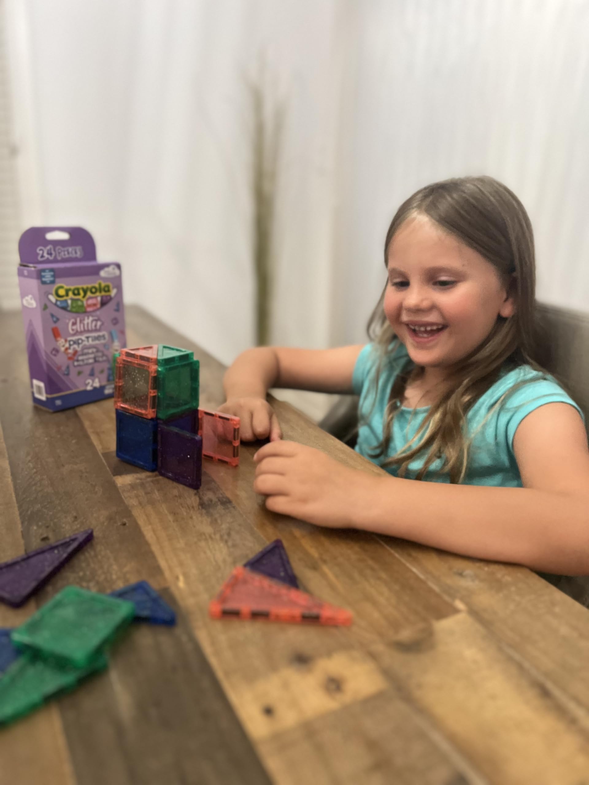 Bright glitter colors of Crayola PIP-Tiles aid color recognition and pattern play.