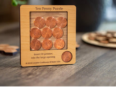 Creative Crafthouse penny puzzle in hand demonstrates portability and engagement.