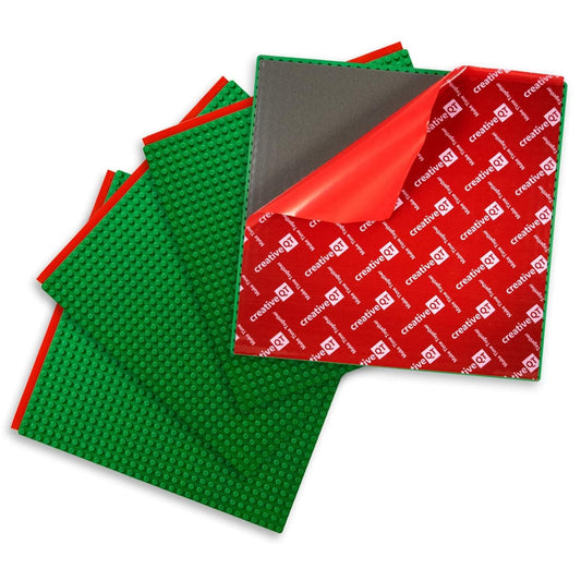 Creative QT baseplates green 4-pack mounted on wall for mess-free building fun.
