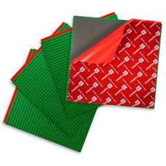 Creative QT baseplates green 4-pack mounted on wall for mess-free building fun.