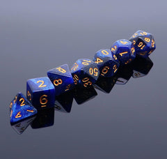 Marbled blue-black dice with rounded corners highlighting craftsmanship.