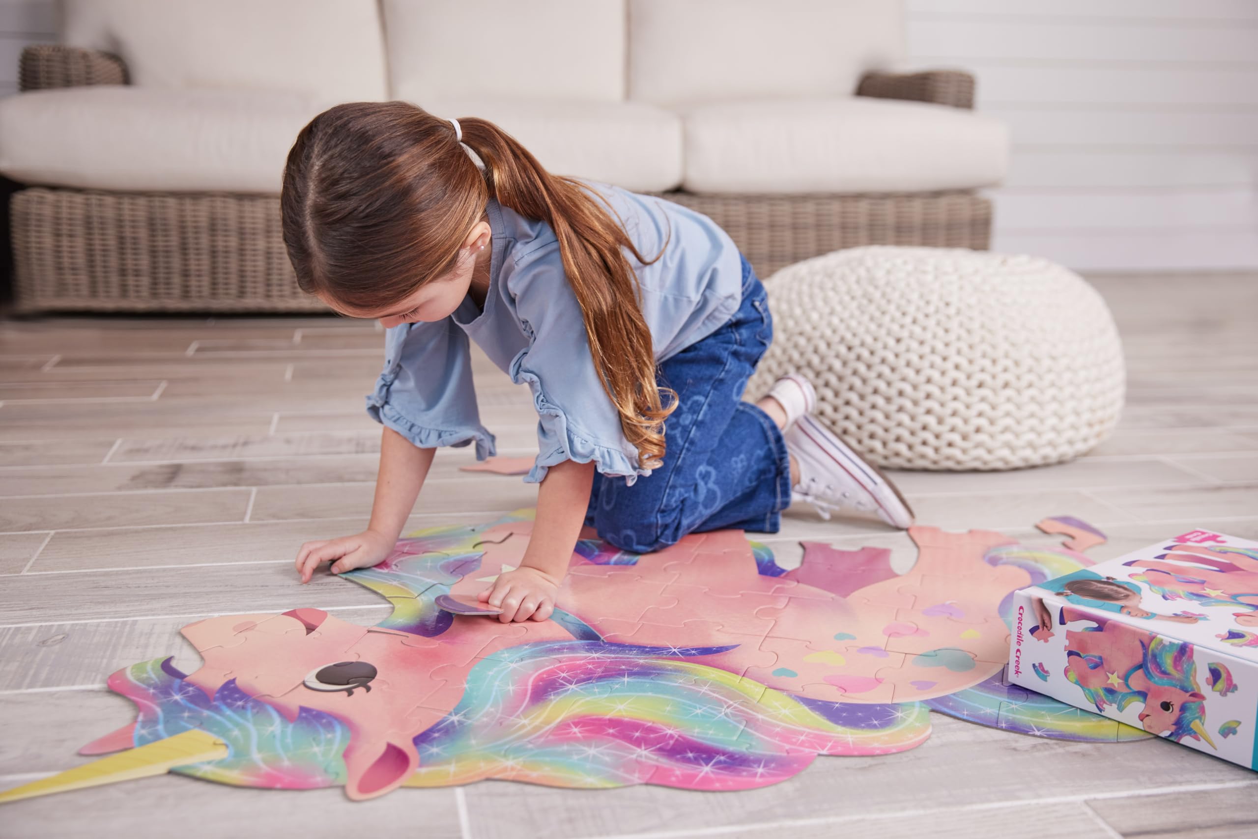 Crocodile Creek finished unicorn puzzle size 38.5 by 33.5 inches on the floor.