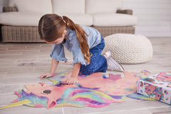 Crocodile Creek finished unicorn puzzle size 38.5 by 33.5 inches on the floor.
