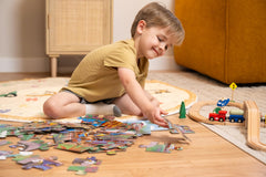 Crocodile Creek floor puzzle in use with children developing coordination.