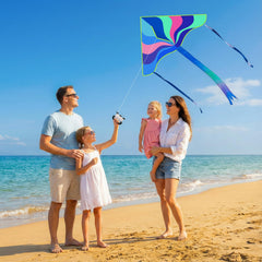 Crogift family at the beach enjoying kite-flying together.