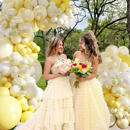 Crossfingers yellow balloons closeup showcasing double stuffed design and color depth