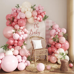 CROSSFINGERS dusty pink balloon arch kit setup for stylish baby showers
