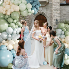 Crossfingers sage green 18-inch balloons add soft, elegant accents.