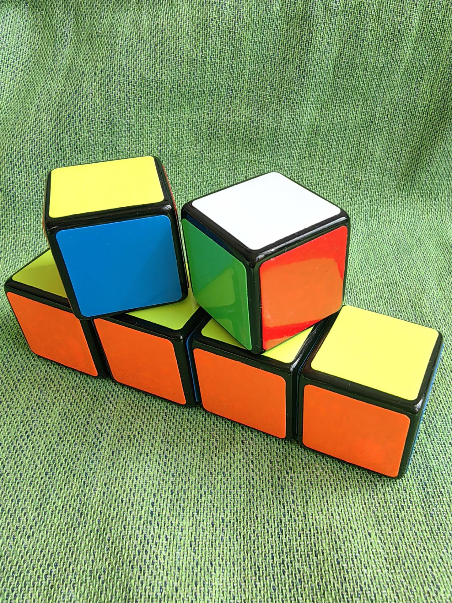 Cuberspeed 1x1x1 speed cube held in hand for on-the-go solving.