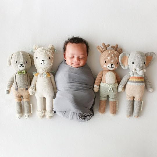Cuddle + Kind Elliott the Fawn doll, fair trade label highlights ethical production.