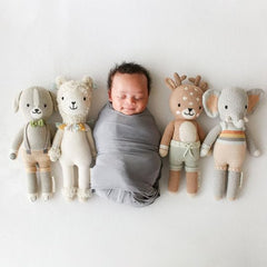 Cuddle + Kind Elliott the Fawn doll, fair trade label highlights ethical production.