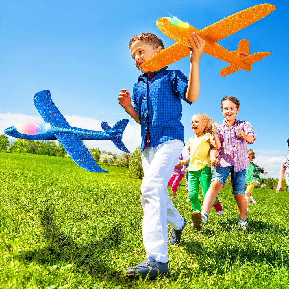 CUKU LED Airplane children playing outdoors with vivid planes.