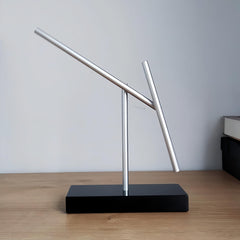 CulinaryEdge kinetic energy pendulum displayed in meeting room acts as focal art.