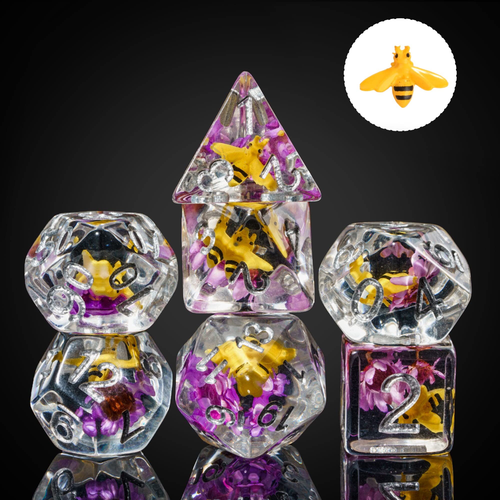 Cusdie dice close-up; bee in purple flower interior seen through transparent resin