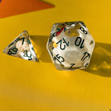 Cusdie D12 clear resin dice with chick inside reflecting light beautifully