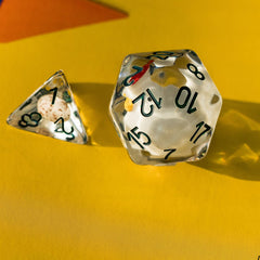 Cusdie D12 clear resin dice with chick inside reflecting light beautifully