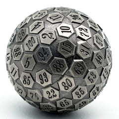 Cusdie D100 metal dice in ancient silver, close-up, highlighting the large 100 faces