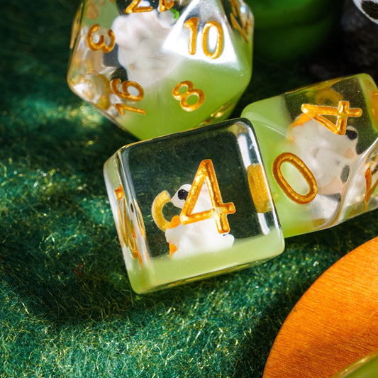 Cusdie DND dice with rabbit eating carrots inside the die