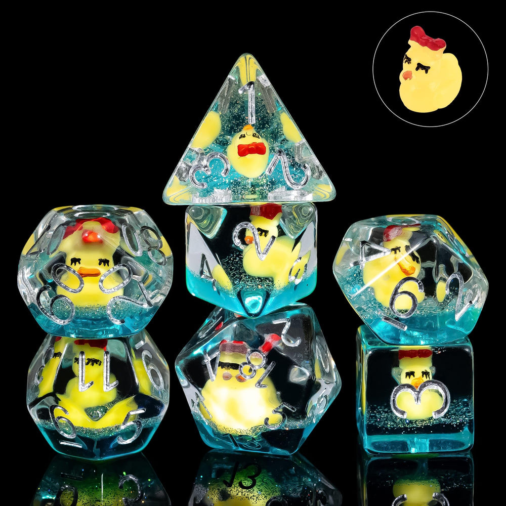 Close up of Cusdie DND Dice Set yellow duck with bow on transparent dice