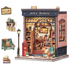 CUTEBEE Book Nook Kit wood dollhouse during assembly on a work table.