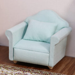 Cutemini couch close-up reveals detailed fabric texture and colorful cushions.