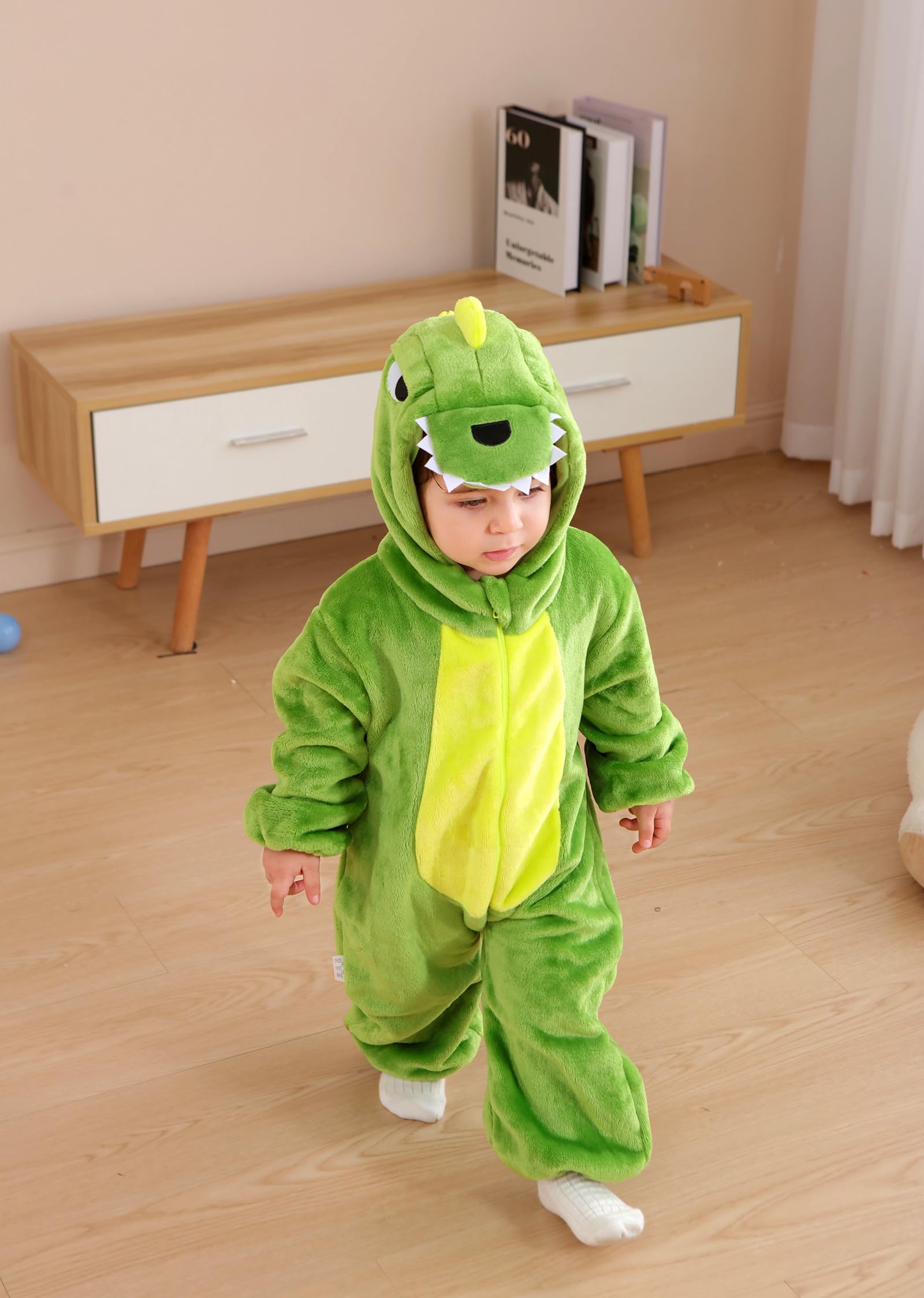 Easy diaper change access with full-length zipper on CuteOn dinosaur romper.