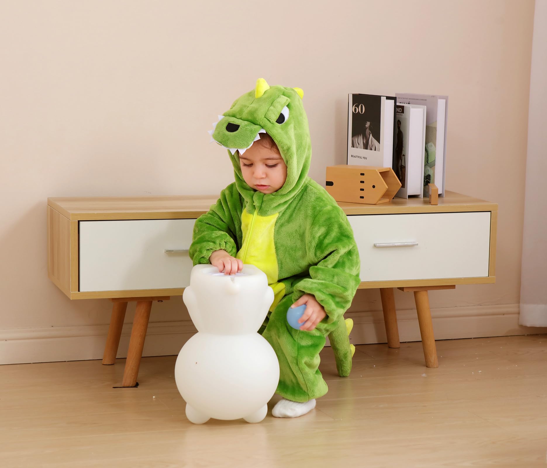 Holiday-ready CuteOn green dinosaur onesie for Halloween and Christmas.