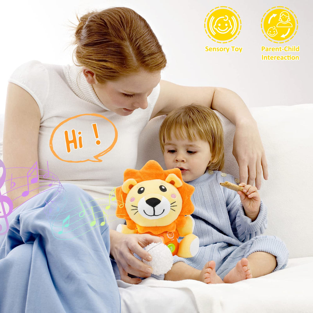 Daboot lion plush in tiny hands demonstrates easy grasp for babies.