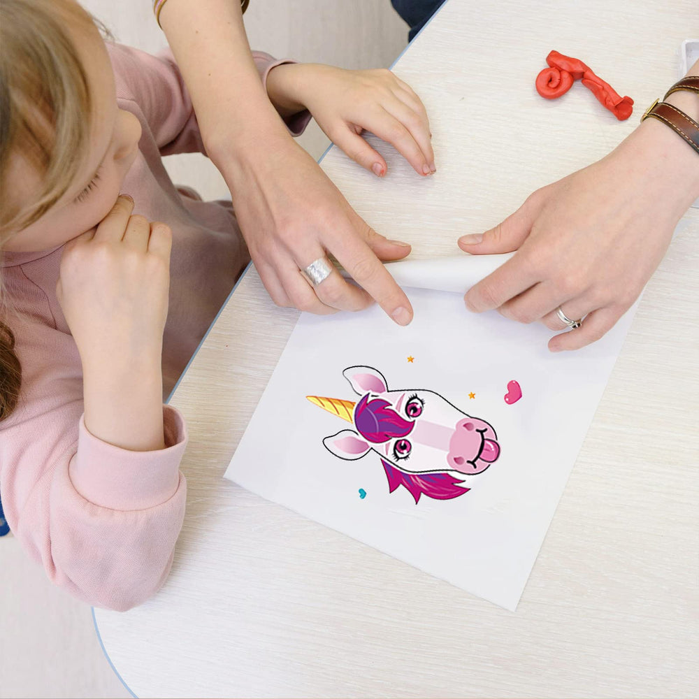 DaiUni unicorns face stickers decorating notebooks and cards during party
