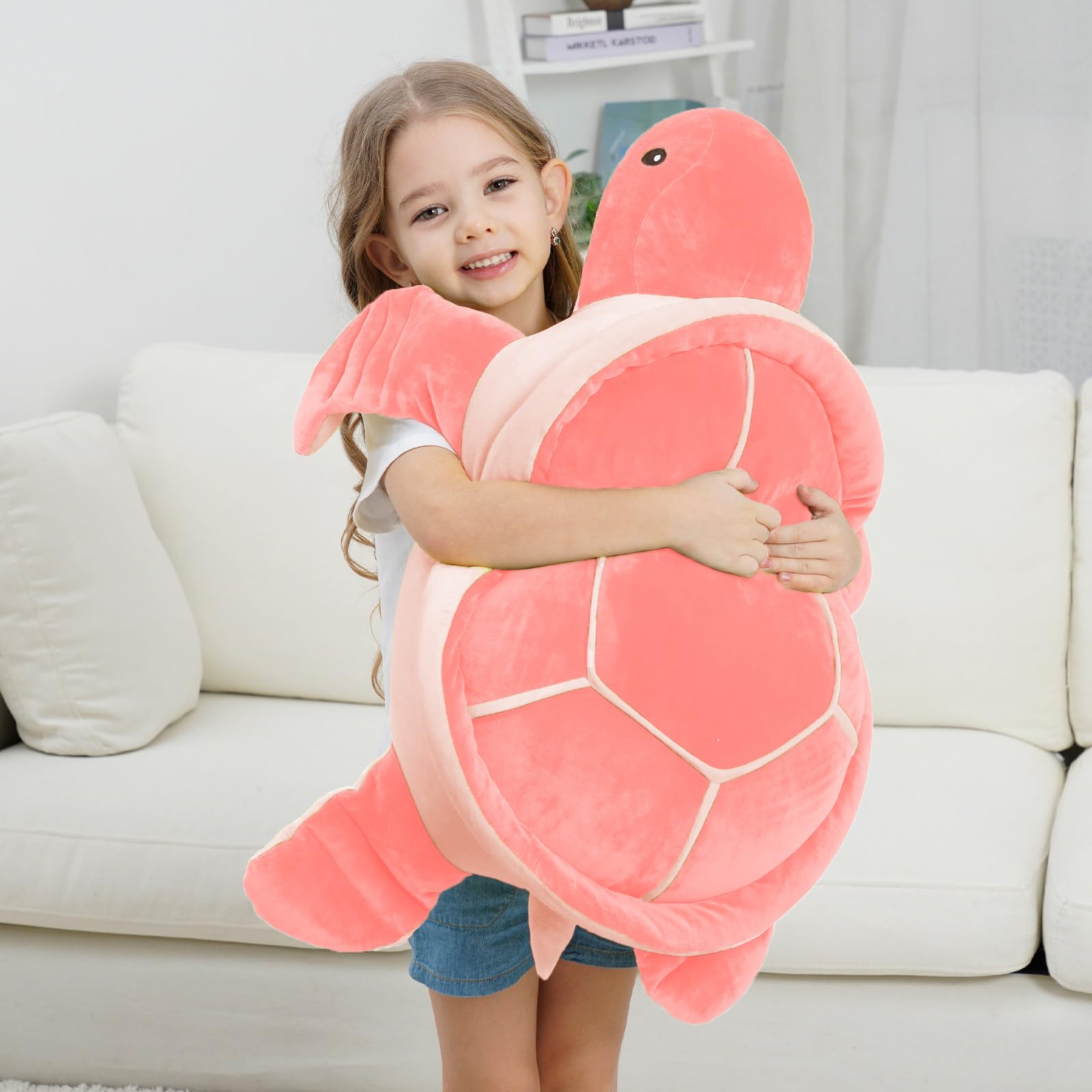 Dalmao large turtle plush lounging on couch demonstrates reading pillow potential.