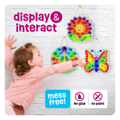 Dan & Darci Slot-board for pom poms enables mess-free pattern building.