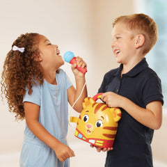 Kids recording and playing back their singing with Daniel Tiger's toy