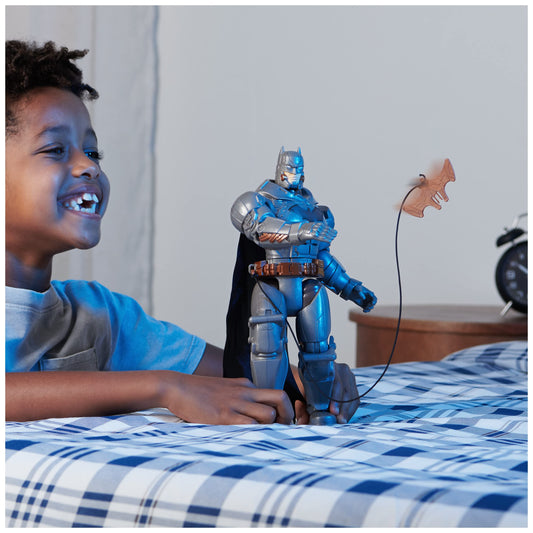 DC Comics Battle Strike Batman with accessories laid out, featuring five gadgets.