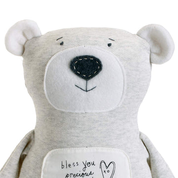 DEMDACO Plush Bless You Bear fabric detail emphasizes soft texture for imaginative play