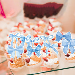 Deorfuy blue bow toppers shown on desserts for coordinated party style