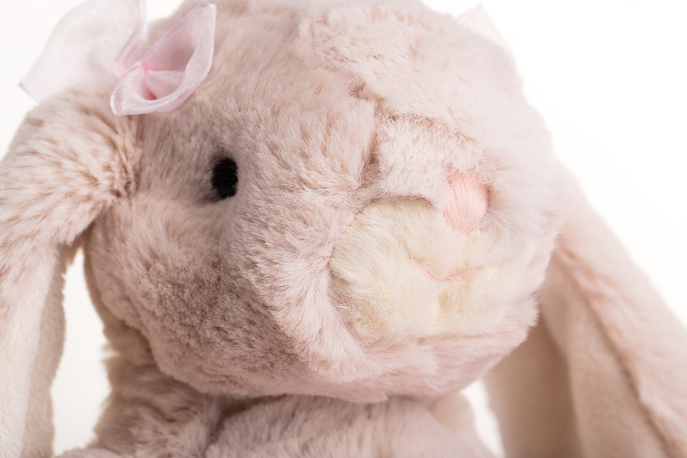 DILLY DUDU Bunny weighted ears and legs enable poseable display.